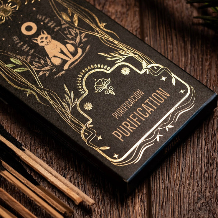 Black box labeled 'Purification' with gold text and design on a wooden surface.