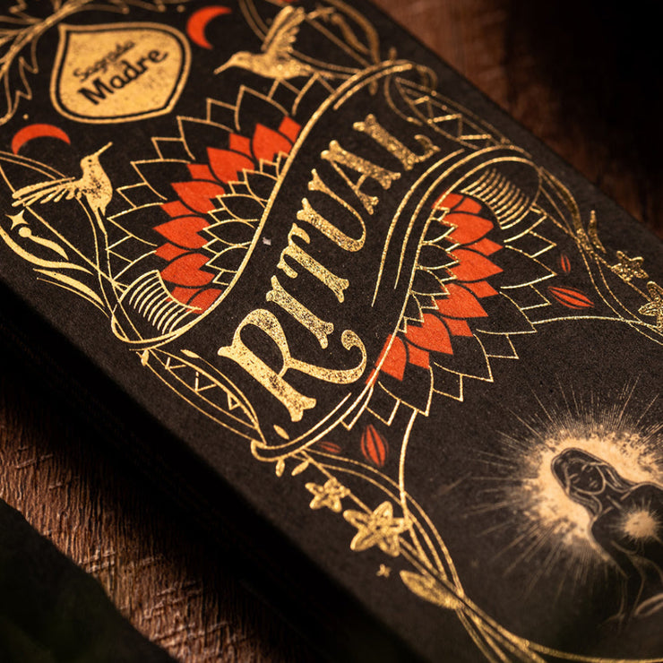 Decorative box with intricate designs and text on a dark background