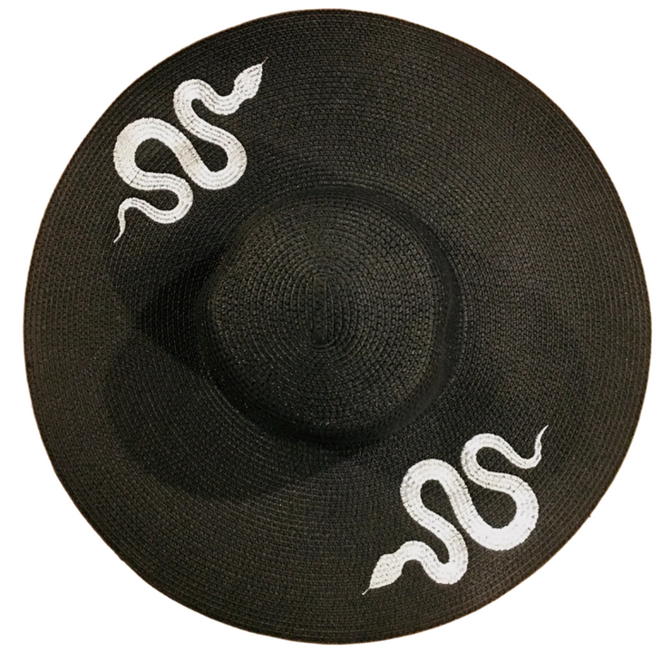 Black straw hat with white snake designs on a white background