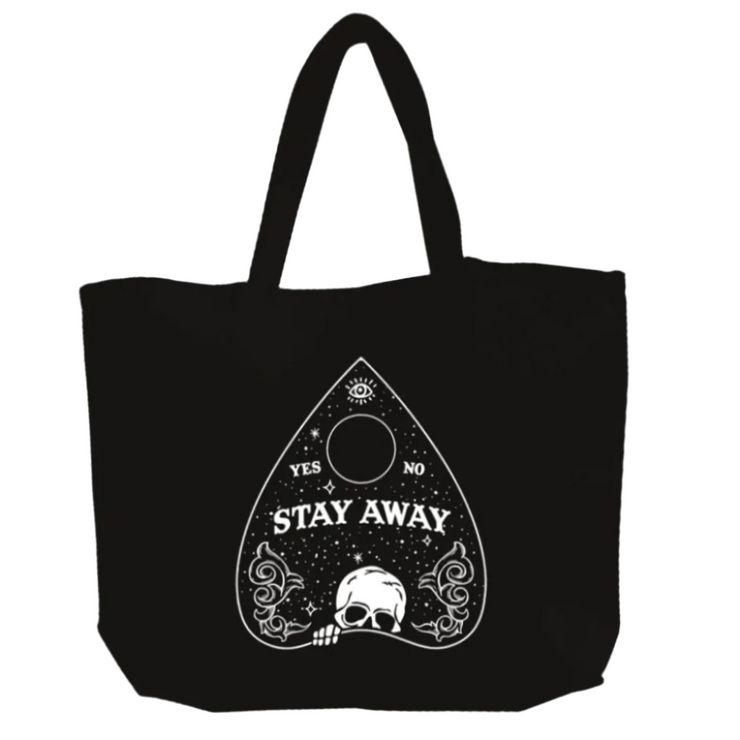 Black tote bag with white graphic design featuring text and a skull on a white background