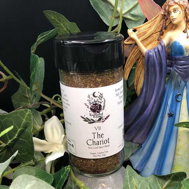 Spice jar labeled 'The Chariot' with a fairy figurine and greenery in the background