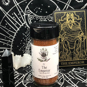 Spice jar labeled 'The Emperor' on a black background with astrological symbols and tarot card.
