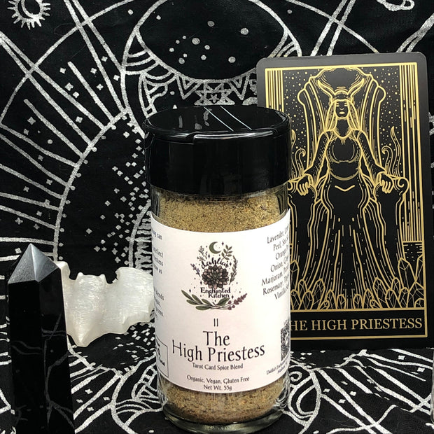 Spice jar labeled 'The High Priestess' with tarot card and crystals on a black background with white symbols.