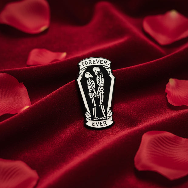 Skeleton couple pin with 'Forever and Ever' text on a light colored background