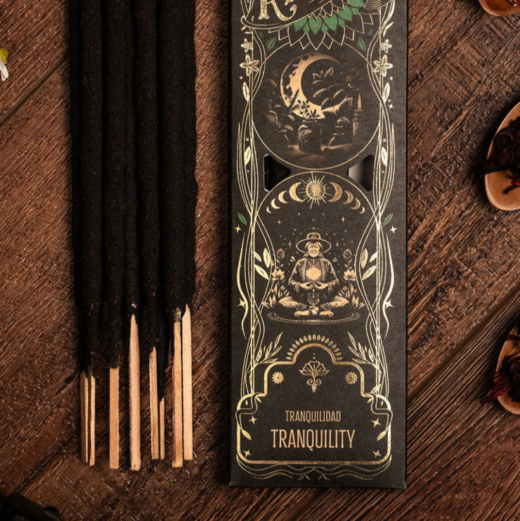 Incense sticks with their packaging labeled 'Ritual Tranquility' on a wooden surface.