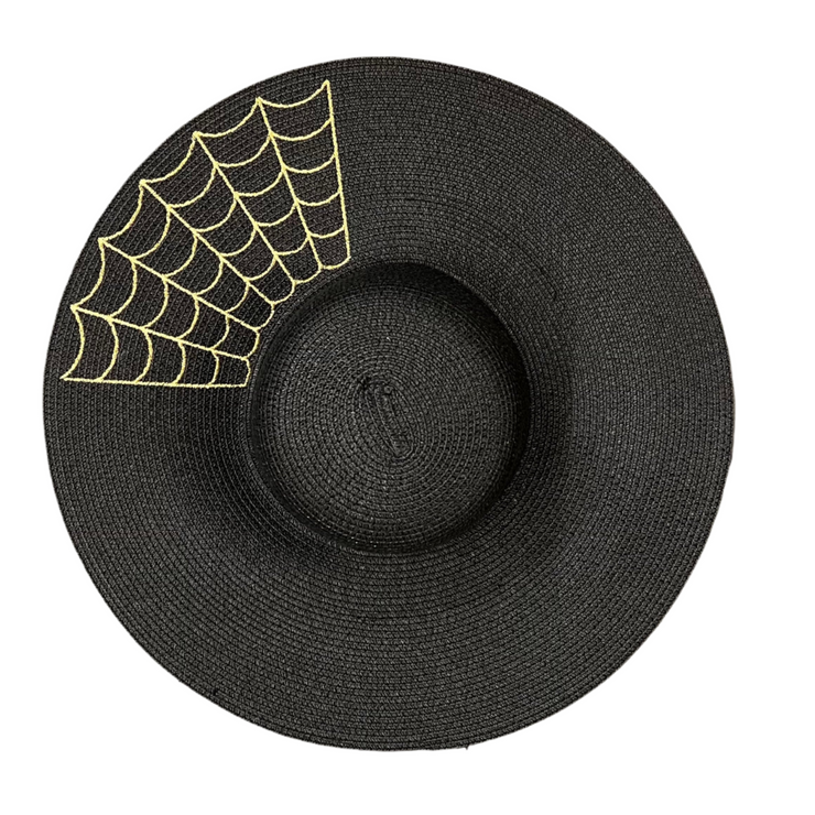 Black straw hat with gold spider web design on a white background