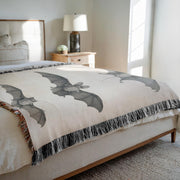 Bats of Egypt Woven Throw Blanket [Chauve-Souris D'Egypte] featuring the first plate from Histoire Naturelle volumes, showcasing Egyptian campaign discoveries by French scholars. This beautifully crafted blanket is perfect for any setting—use it as a stunning wall decoration, a cozy throw for your sofa, or even a unique picnic spread.