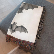 Bats of Egypt Woven Throw Blanket [Chauve-Souris D'Egypte] featuring the first plate from Histoire Naturelle volumes, showcasing Egyptian campaign discoveries by French scholars. This beautifully crafted blanket is perfect for any setting—use it as a stunning wall decoration, a cozy throw for your sofa, or even a unique picnic spread.