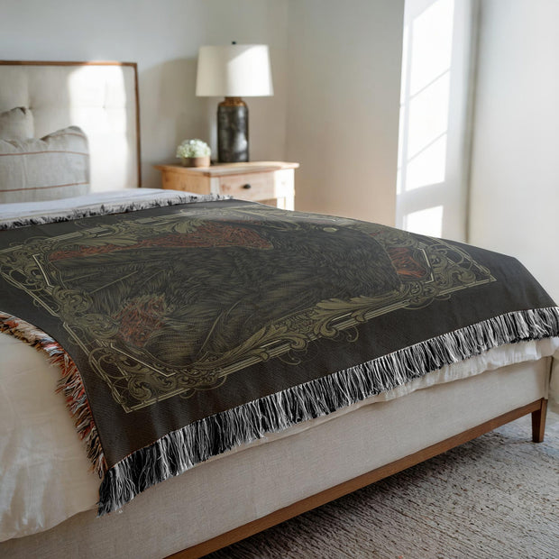 Death of a Crow Woven Throw Blanket, a beautifully crafted piece perfect for any setting. This blanket features a detailed crow and an ornate background, suggesting themes of transformation, the unknown, and the crossing between life and death.