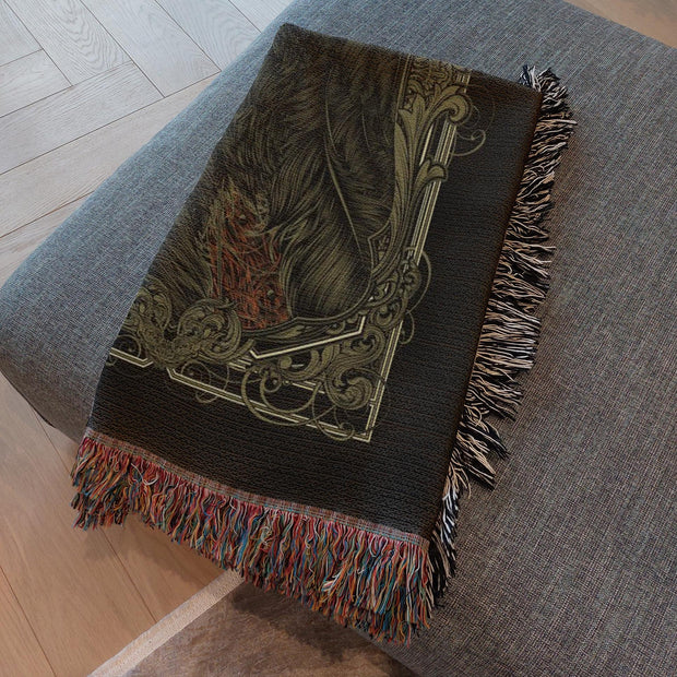 Death of a Crow Woven Throw Blanket, a beautifully crafted piece perfect for any setting. This blanket features a detailed crow and an ornate background, suggesting themes of transformation, the unknown, and the crossing between life and death.