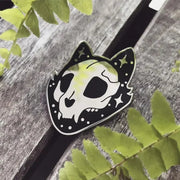 Intricately designed Gothic Cat Skull Enamel Lapel Pin featuring a high gloss silver chrome finish, with the cat's face and ears outlined in striking black enamel and gloss silver star accents.