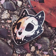 Intricately designed Gothic Cat Skull Enamel Lapel Pin featuring a high gloss silver chrome finish, with the cat's face and ears outlined in striking black enamel and gloss silver star accents.