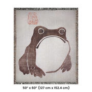 Frog by Matsumoto Hoji Woven Throw Blanket from Meika Gafu, 1814, featuring a sad-faced frog in black ink beneath red calligraphy. This Zen-inspired design was common during the Japanese Edo period, representing a pure and natural life.