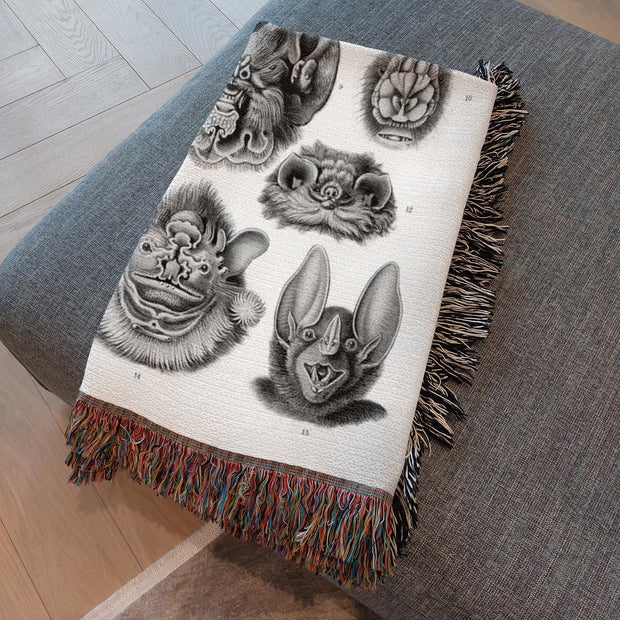 Vampire Bats Woven Throw Blanket featuring 'Chiroptera - Vampyrus' from Kunstformen der Natur by Ernst Haeckel. This beautifully crafted blanket is perfect for any setting—use it as a stunning wall decoration, a cozy throw for your sofa, or even a unique picnic spread.