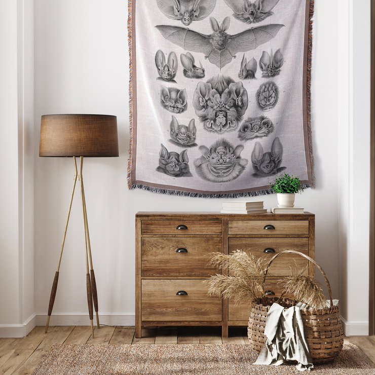 Vampire Bats Woven Throw Blanket featuring 'Chiroptera - Vampyrus' from Kunstformen der Natur by Ernst Haeckel. This beautifully crafted blanket is perfect for any setting—use it as a stunning wall decoration, a cozy throw for your sofa, or even a unique picnic spread.