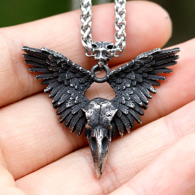 Meticulously detailed Wings of the Raven Skull Stainless Steel Pendant Necklace crafted from high-quality 316L stainless steel with an antiqued finish, showcasing an intricately designed raven skull and wings.