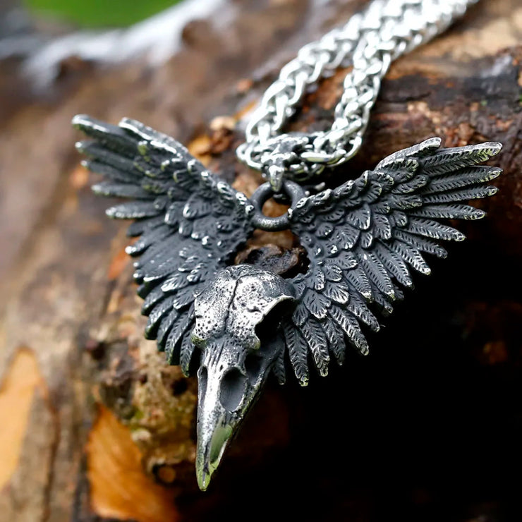 Meticulously detailed Wings of the Raven Skull Stainless Steel Pendant Necklace crafted from high-quality 316L stainless steel with an antiqued finish, showcasing an intricately designed raven skull and wings.