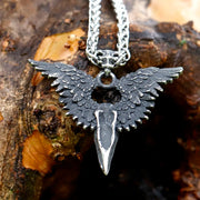 Meticulously detailed Wings of the Raven Skull Stainless Steel Pendant Necklace crafted from high-quality 316L stainless steel with an antiqued finish, showcasing an intricately designed raven skull and wings.