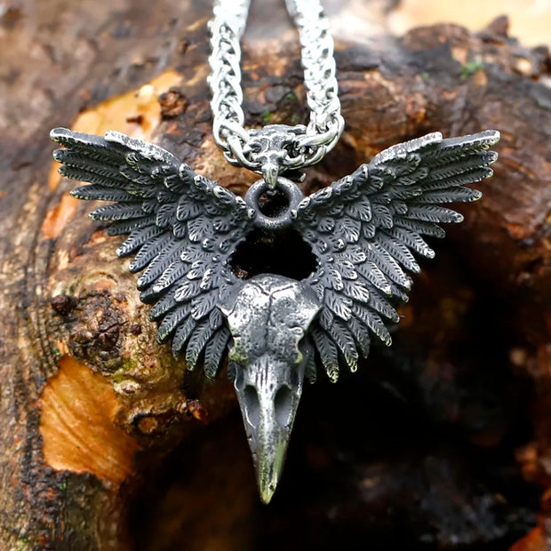 Meticulously detailed Wings of the Raven Skull Stainless Steel Pendant Necklace crafted from high-quality 316L stainless steel with an antiqued finish, showcasing an intricately designed raven skull and wings.